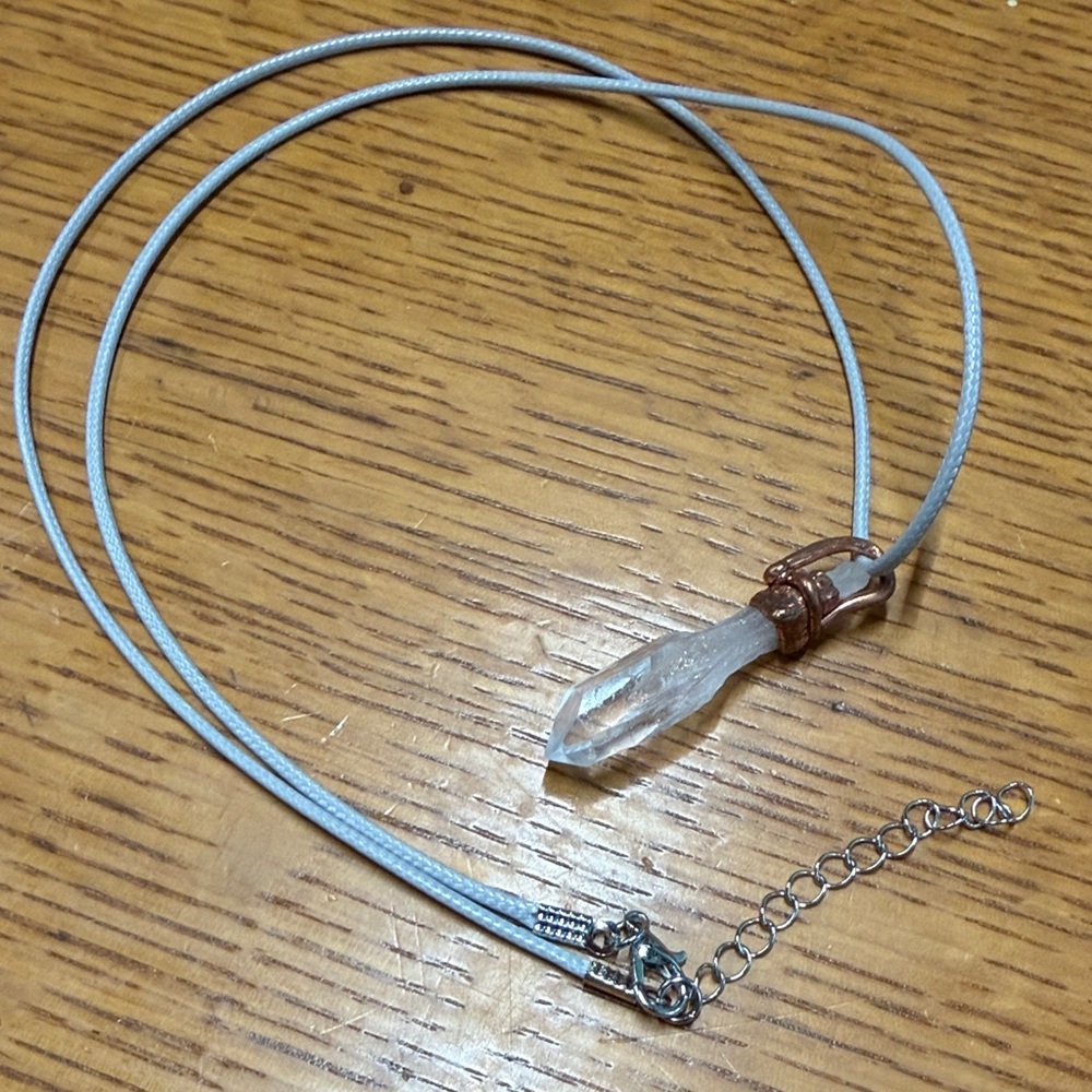 Crystal Point Pendant Necklace in on gray cord